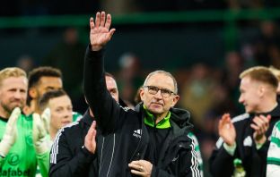 Martin O'Neill salutes the travelling Celtic support.