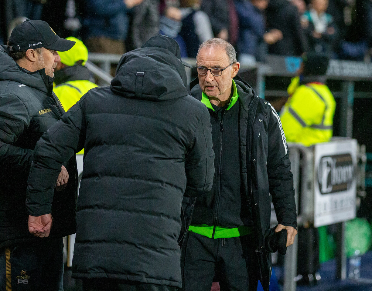 Martin O'Neill and John McGlynn shake hands at the final whistle.