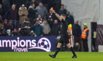 Referee Steven McLean shows Auston Trusty a red card after a VAR review. Hearts v Celtic, 25 January 2025. Photo Vagelis Georgariou.