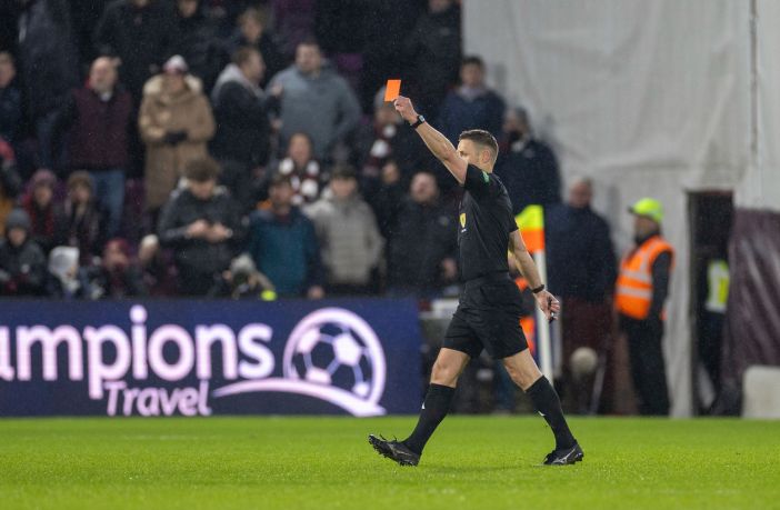Referee Steven McLean shows Auston Trusty a red card after a VAR review. Hearts v Celtic, 25 January 2025. Photo Vagelis Georgariou.