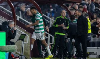 Auston Trusty walks off after being shown a red card. Martin O'Neill looks on.