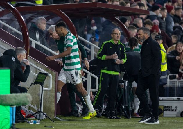 Auston Trusty walks off after being shown a red card. Martin O'Neill looks on.