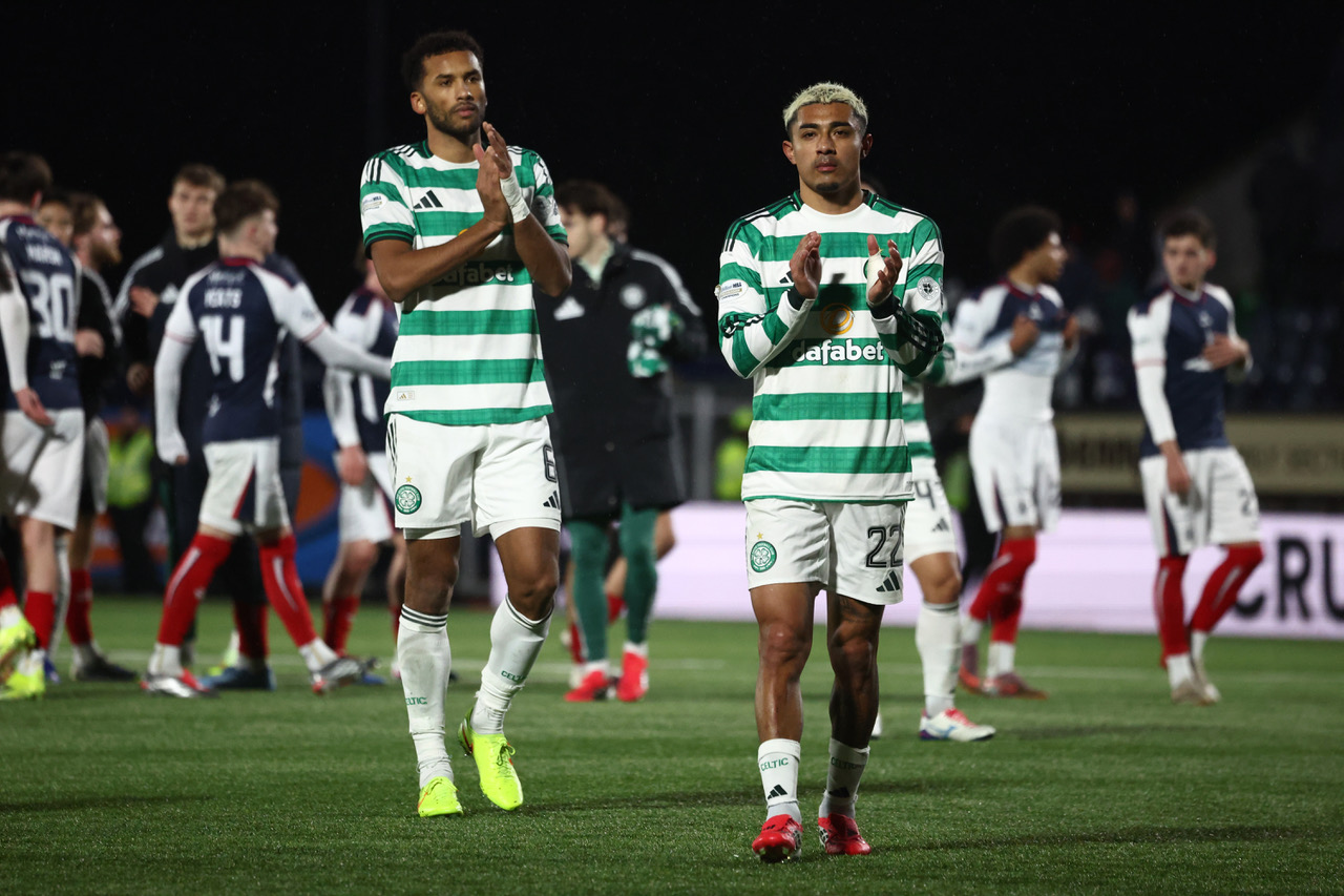 Auston Trusty and Julian Araujo applaud the Celtic support.
