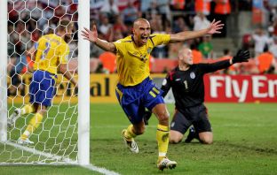 Henrik Larsson of Sweden celebrates scoring against England