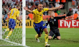 Henrik Larsson of Sweden celebrates scoring against England