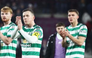 Callum McGregor applauds the Celtic fans