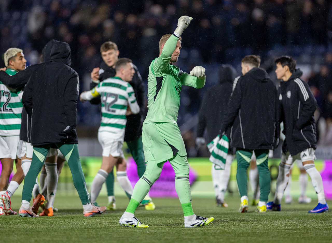 Kasper Schmeichel applauds the travelling support.