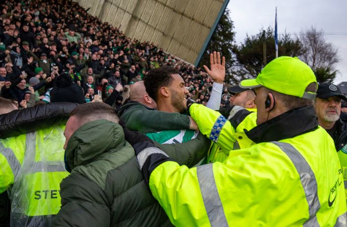 Auston Trusty celebrates with the Celtic supporters.