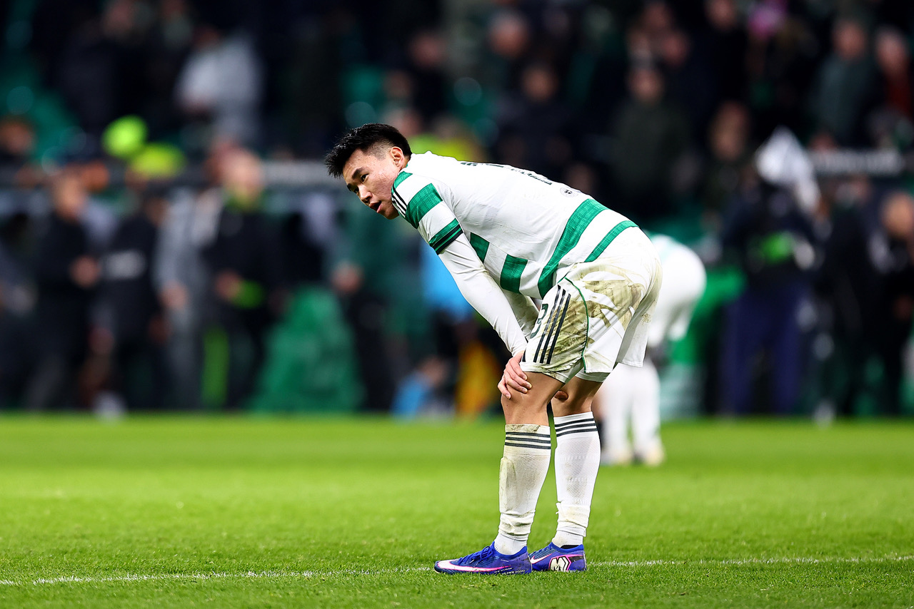 Yang of Celtic looks dejected 