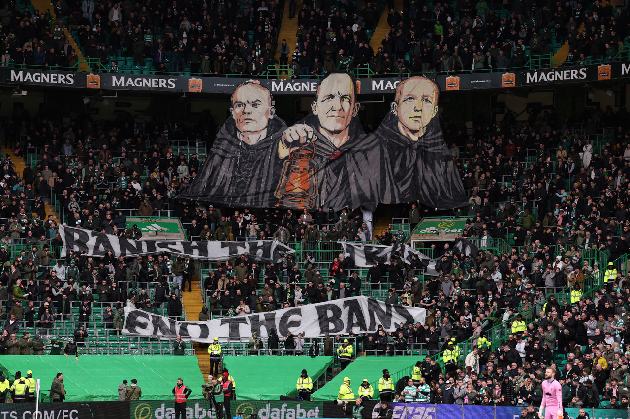 Celtic fans display a banner against the board