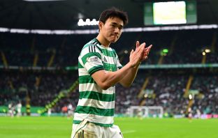 Yang of Celtic applauds the crowd
