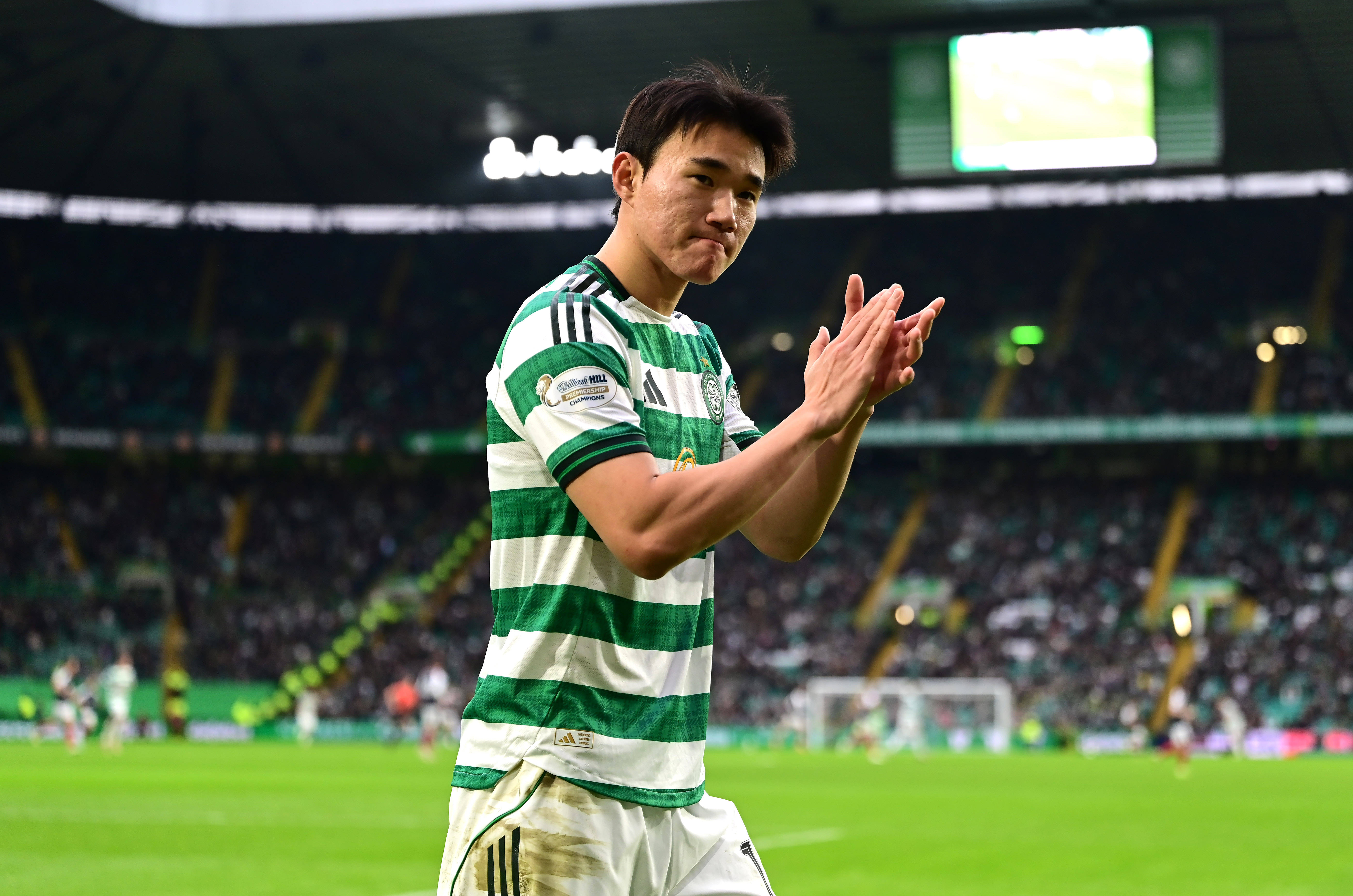 Yang of Celtic applauds the crowd 