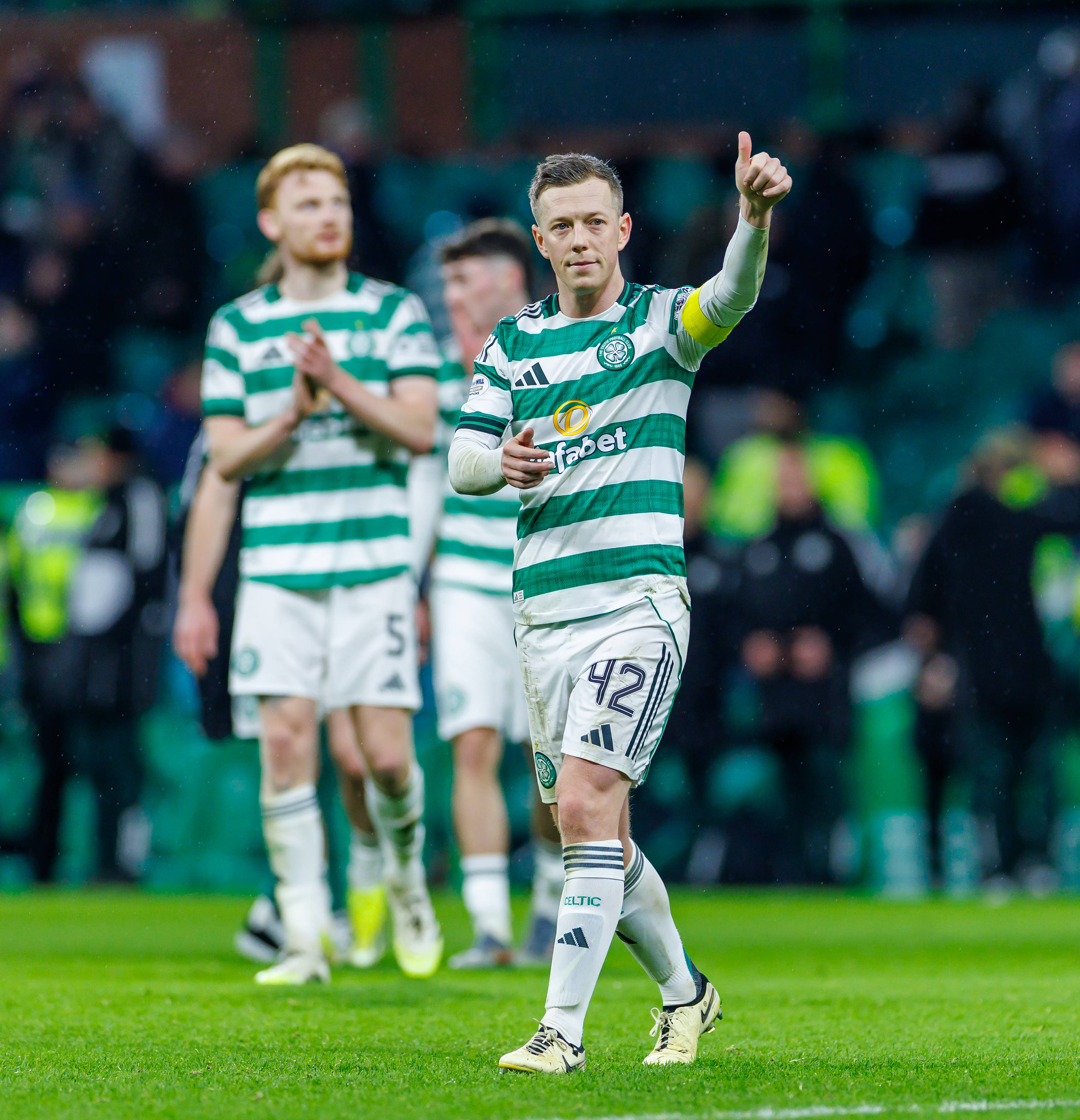 Callum McGregor applauds the Celtic support