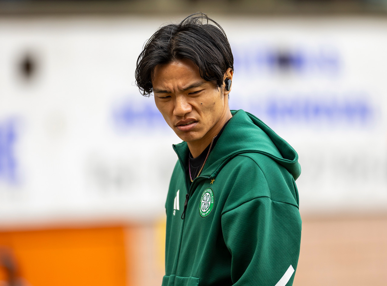 Reo Hatate inspects the pitch at Tannadice. 
