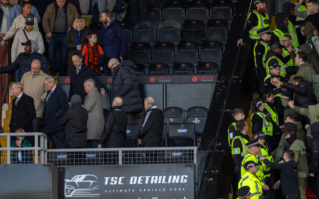 Celtic fans and the Celtic Board at Tannadice.