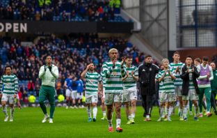 Celtic players applaud the Celtic support.