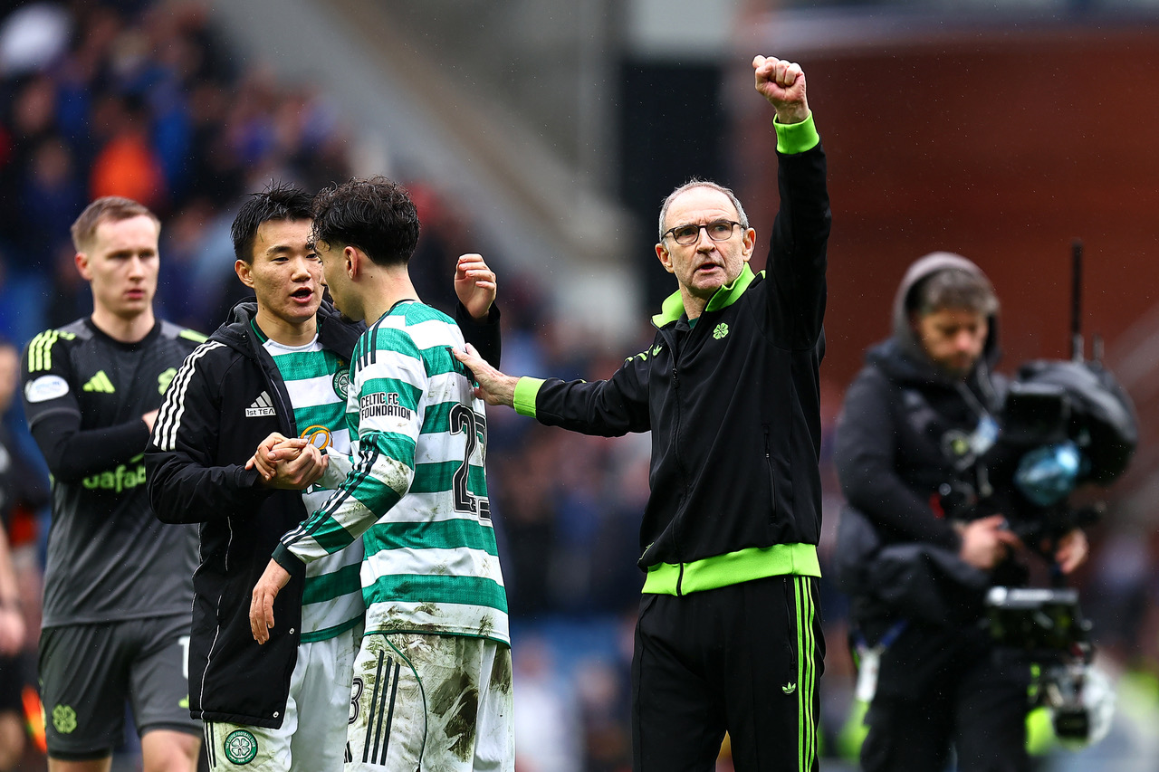 Martin O'Neill, Manager of Celtic acknowledges the fans