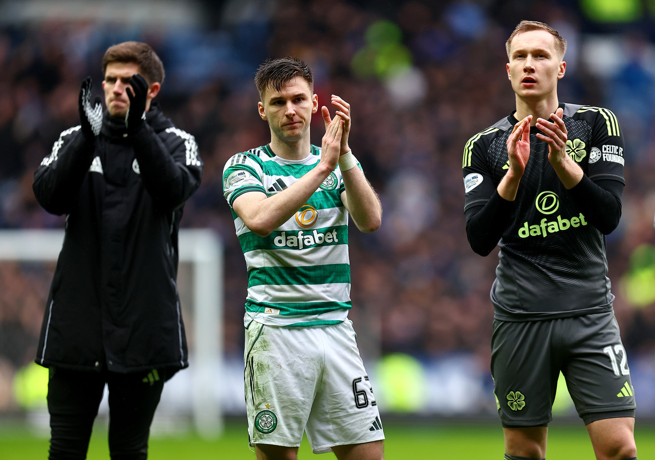Kieran Tierney and Viljami Sinisalo of Celtic applaud the fans