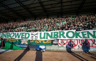 Unbowed. Unbroken - The Celtic support at Dens Park.