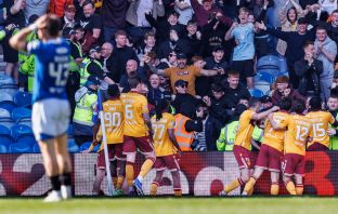 Motherwell celebrate scoring a late winner at Ibrox