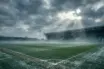 Celtic Park stadium on a cold winter day with moody atmospheric lighting and training pitch
