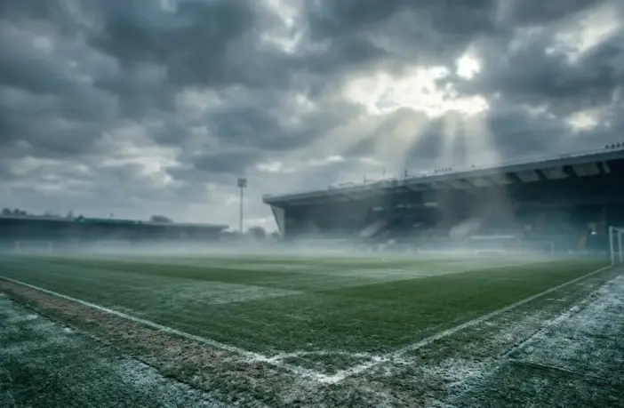 Celtic Park stadium on a cold winter day with moody atmospheric lighting and training pitch