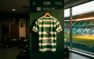 Celtic FC jersey in iconic green hoops hanging in stadium dressing room with natural lighting
