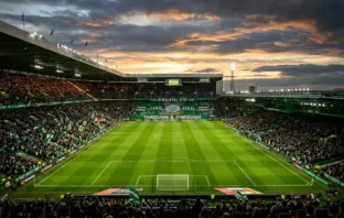 Celtic Park stadium under floodlights before crucial title decider match at Paradise