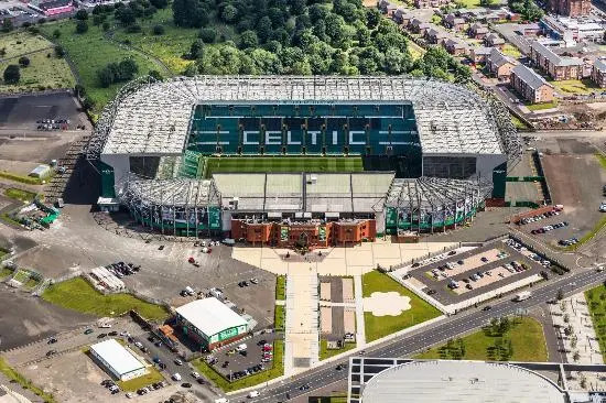 Aerial view of Celtic Park stadium in Glasgow, with visible signage and surrounding area.