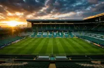 Celtic Park stadium at sunset with empty pitch awaiting Champions League preparation and summer rebuild