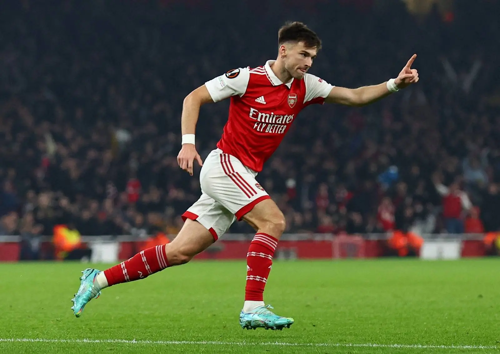 Kieran Tierney celebrating a goal for Arsenal FC in a match.
