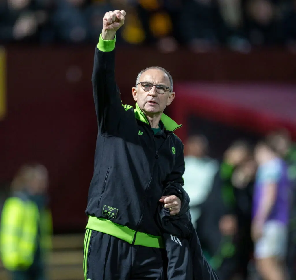 Celtic manager Martin O'Neill celebrating with a raised fist.