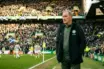 Experienced football manager contemplating future on matchday at Celtic Park stadium