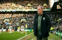 Experienced football manager contemplating future on matchday at Celtic Park stadium
