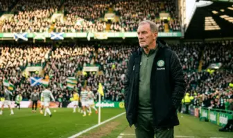 Experienced football manager contemplating future on matchday at Celtic Park stadium