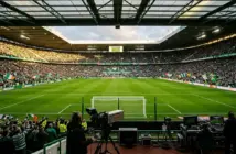 Celtic Park stadium with broadcast cameras ready for live TV coverage of crucial title race match
