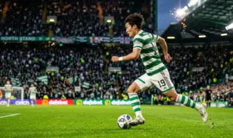 Celtic winger Yang Hyun-jun sprinting with ball in green and white hooped jersey at Celtic Park