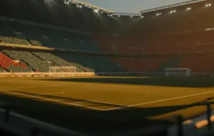 Floodlit stadium at golden hour with packed stands in Australian green and Egyptian red colours, dramatic shadows across pitch.