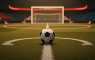 Empty floodlit football pitch with ball on centre spot, gold-hour stadium lighting, red and white accent colours.