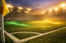 Floodlit football pitch at dusk with emerald and gold lighting, cinematic shadows, corner-flag perspective.