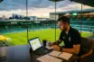 Football recruitment strategy scene overlooking stadium pitch at dusk with tactical planning materials