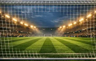 Illuminated women's football stadium pitch under floodlights awaiting crucial derby match