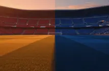 Floodlit stadium pitch at golden hour with packed stands, divided lighting creating dramatic shadows across the field.