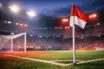 Floodlit football pitch corner in Japanese flag colours (red and white), empty stadium, cinematic lighting