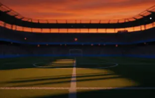Empty floodlit stadium pitch with dramatic shadows, Dutch orange and Swedish blue atmospheric lighting at dusk.