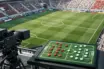 Broadcast gantry view of football pitch with tactical analysis equipment and colour-coded formation magnets