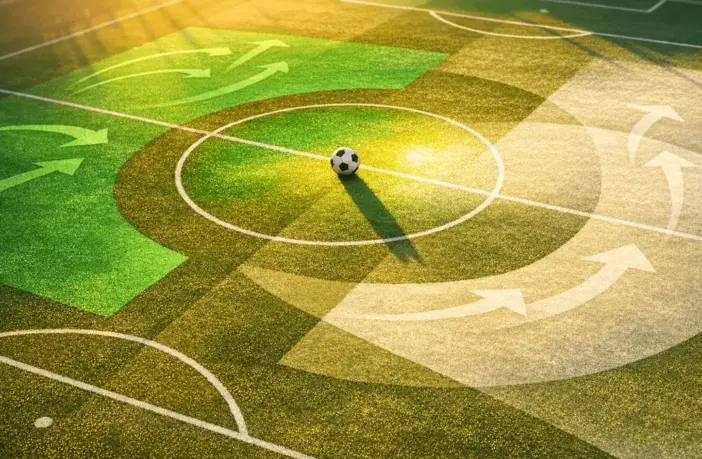 Abstract aerial pitch view with Saudi Arabian flag colours, tactical overlays, and centre-circle football at golden hour.