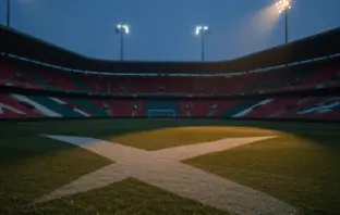 Empty floodlit stadium at dusk with Scottish blue-white and Moroccan red-green colour palette, dramatic shadows, rain-wet pitch.