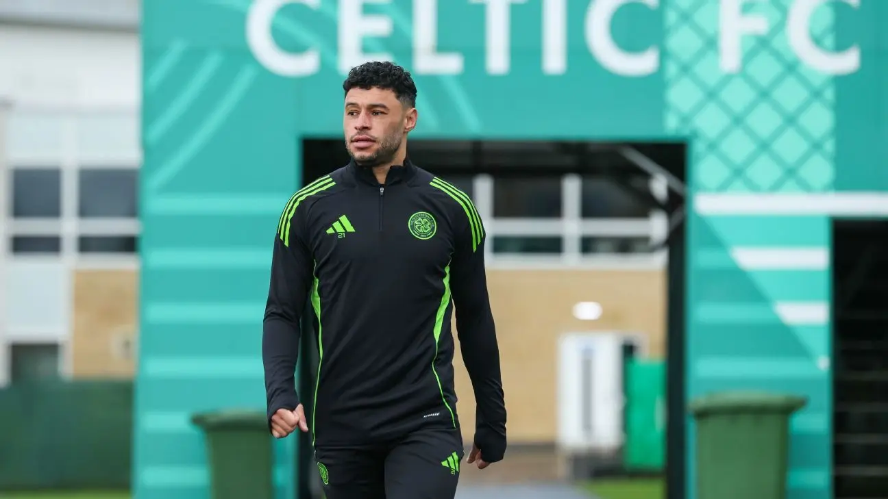 Alex Oxlade-Chamberlain in Celtic FC training gear walking at the training facility.