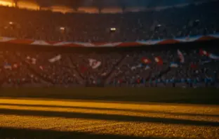 Floodlit quarter-final stadium at dusk with dramatic lighting, packed stands, and golden-hour atmosphere during World Cup competition.
